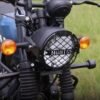 Zombieeast Headlight jaali grill for RE Hunter Black. Made with premium quality iron metal, which makes the structure very stable, hard and long lasting. It is durable enough protect your headlight from any collision or accident. Designed in structure of jaali grill which disperse the impulse in all direction save the headlight in case of collision or crash. The design is simple but effective for cruiser bikes like RE as they have high impact in case of collision and its important to save the headlight system which is quite expensive. Gives a classy and stylish look to your simple headlight system and protect it from any damage.